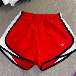 Red Nike shorts